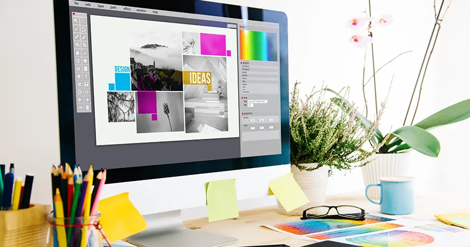 Grafikdesigner arbeitet am Computer an kreativem Design-Layout – individuelles Exposé gestalten mit professioneller Software. Grafikdesigner arbeitet am Computer an kreativem Design-Layout – individuelles Exposé gestalten mit professioneller Software.